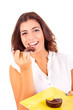 Young woman eating chocolate cake