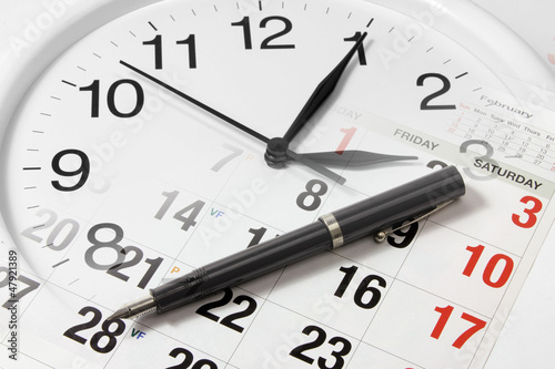 Photo: Pen on Calendar and Clock Pen on Calendar and Clock