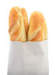 Photo: Baguette bread in paper bag isolated on white Baguette bread in paper bag isolated on white