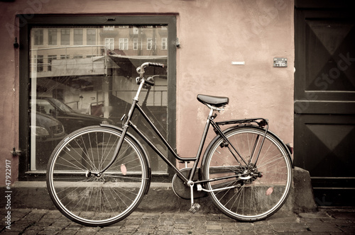 Photo: Classic vintage retro city bicycle in Copenhagen, Denmark Classic vintage retro city bicycle in Copenhagen, Denmark