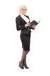 Full length portrait of a blond female teacher holding a book