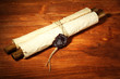 Old scroll, on wooden background