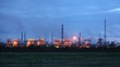 Phosphoric factory in light of lanterns stand against evening