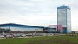 Cars stand, leave and come to office building manufacturer plant