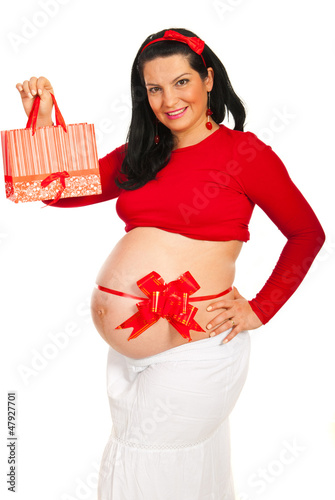 Photo: Pregnant woman with gift Pregnant woman with gift