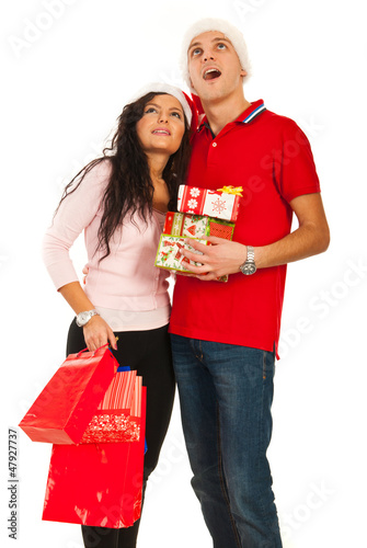 Photo: Amazed Christmas couple looking up Amazed Christmas couple looking up