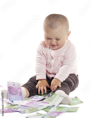 Photo: little girl with money on a white background little girl with money on a white background