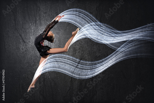 Photo: Young woman in gymnast suit posing Young woman in gymnast suit posing