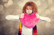 Sad girl with heart. St. Valentine Day