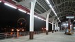 Woman sits on bench on Monorail station