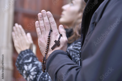 Photo: Hands of a praying couple holding prayer beads Hands of a praying couple holding prayer beads