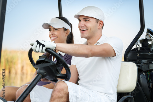 Photo: Happy golf couple Happy golf couple
