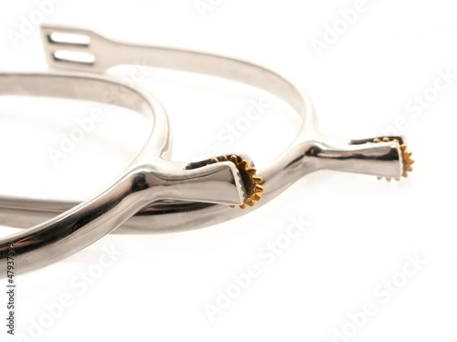 Photo: silver sportive spurs with gold rollers on white silver sportive spurs with gold rollers on white