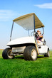 Woman in golf cart