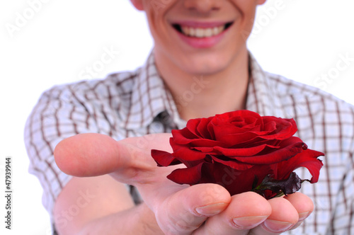 Photo: young boy with a flower in your hand young boy with a flower in your hand