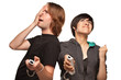 Mixed Race Couple Playing Video Game Remotes on White