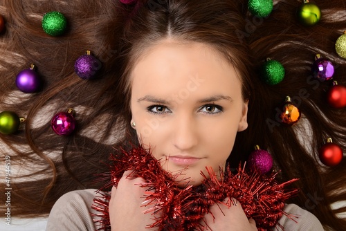 Photo: Beautiful woman with christmas decorations Beautiful woman with christmas decorations