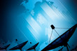 Satellite dish transmission data on background digital blue