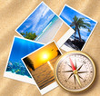 Traveling photos with compass on sand beach