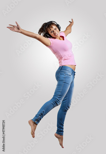 Photo: young woman dancing and jumping young woman dancing and jumping