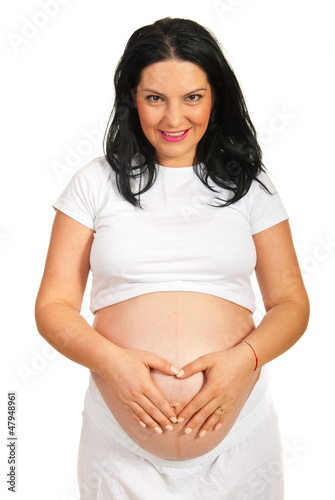 Photo: Pregnant with heart shape on belly Pregnant with heart shape on belly