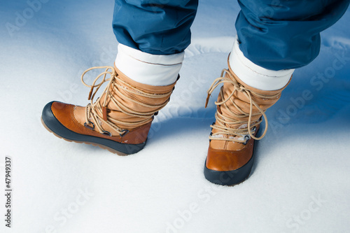 Photo: winter shoes in snow, close-up winter shoes in snow, close-up