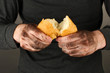 homeless man holding a white bread, close-up