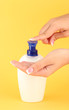woman squeezing lotion