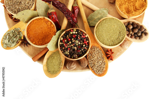 Photo: wooden bowls and spoons with spices, isolated on white wooden bowls and spoons with spices, isolated on white