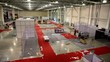 Video: Several workers remove stands in exhibition hangar Several workers remove stands in exhibition hangar