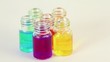 transparent bottles spins with color oil