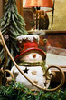Fir tree and ceramic snowman on the window sill