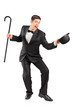 Young performer with cane and hat gesturing