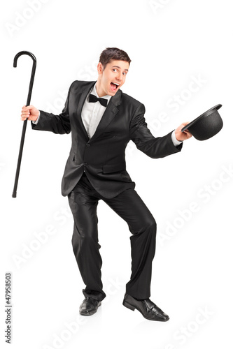 Photo: Young performer with cane and hat gesturing Young performer with cane and hat gesturing