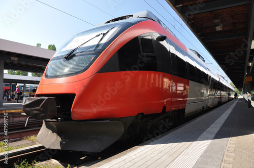 Photo: Passenger train at a station Passenger train at a station