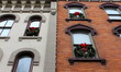 Brick and stone buildings with holiday wreaths