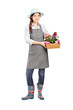 Foto: Full length portrait of a female gardener holding flower plants Full length portrait of a female gardener holding flower plants
