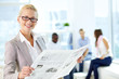 Female reading newspaper