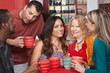 Attractive Ladies with Men in Cafe