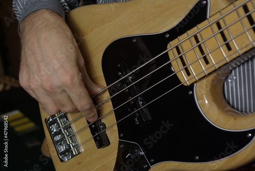 Photo: Man playing an bass guitar Man playing an bass guitar