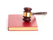 Judge's gavel on red legal book