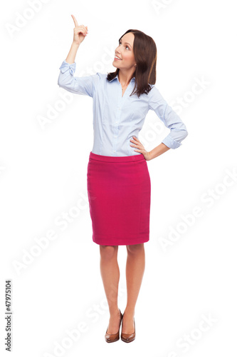Photo: Attractive businesswoman pointing up Attractive businesswoman pointing up