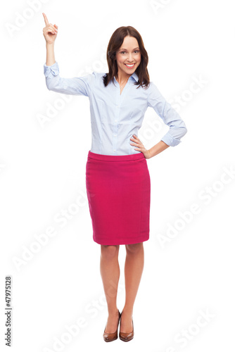 Photo: Attractive businesswoman pointing up Attractive businesswoman pointing up