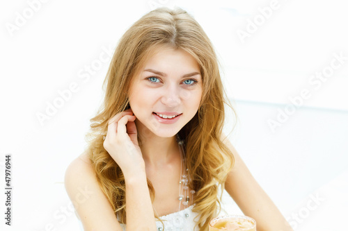Photo: Young woman in cafe Young woman in cafe