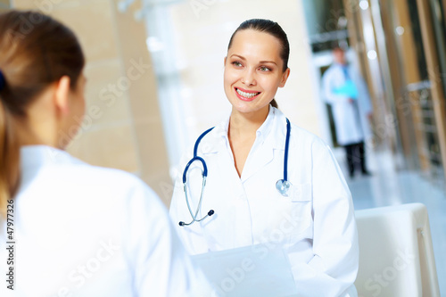 Photo: Portrait of two friendly female doctors Portrait of two friendly female doctors
