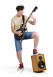 Photo: Man in shorts with an electric guitar on white background Man in shorts with an electric guitar on white background