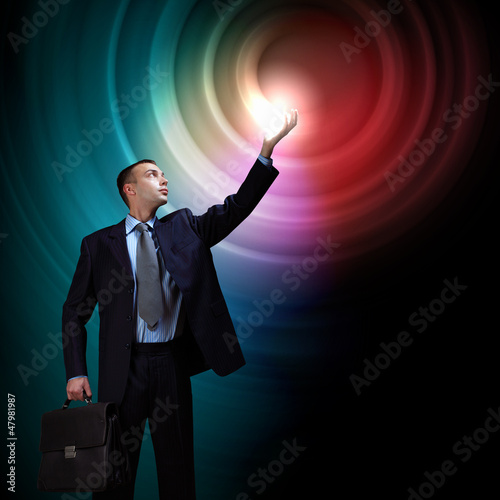 Photo: Businessman with light shining Businessman with light shining