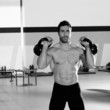 Crossfit man lifting kettlebell workout exercise