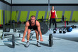gym with weight lifting bar workout man and woman