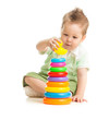 Cute boy playing colorful tower isolated on white
